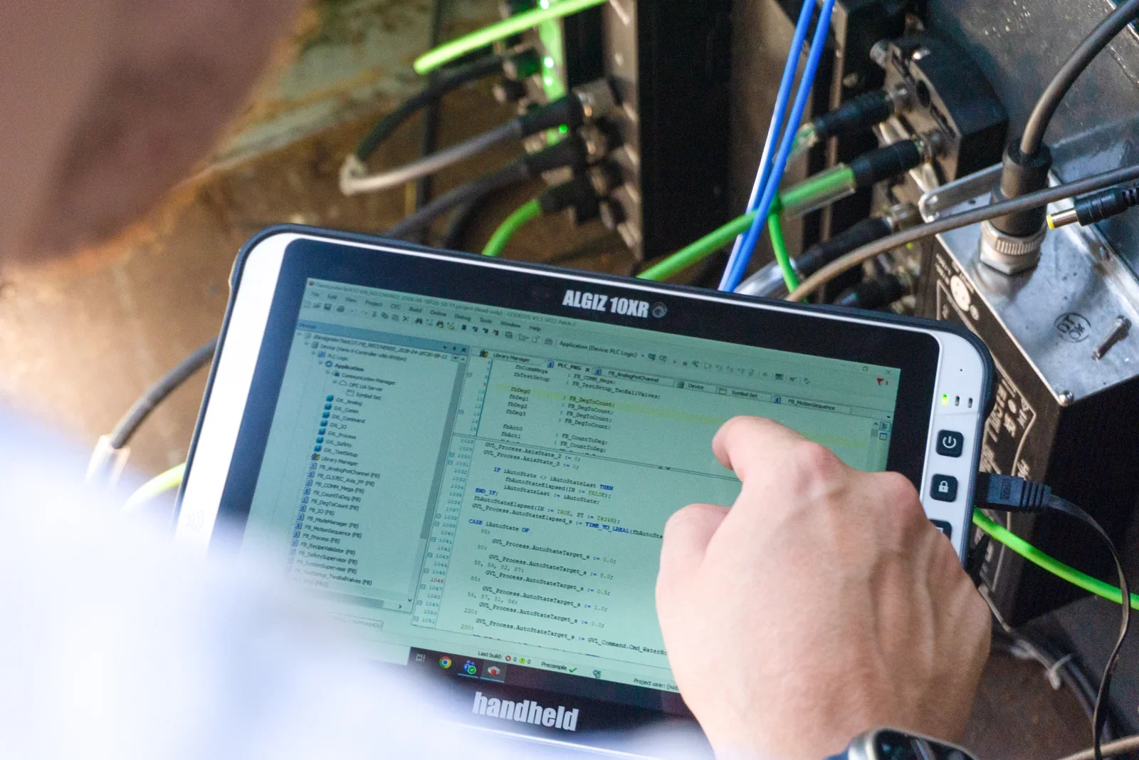 Elara engineer operating test-stand controls on a tablet