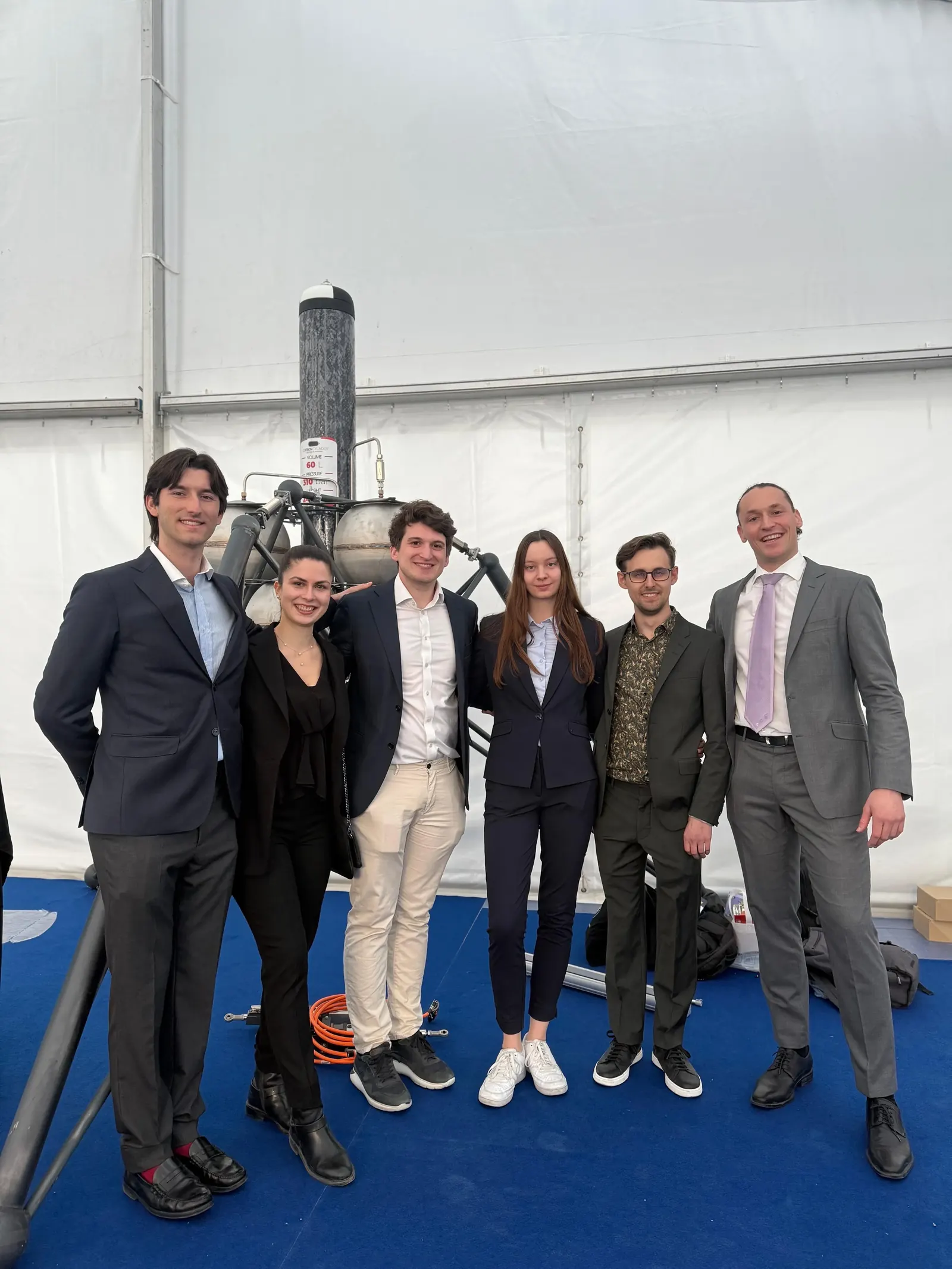 Elara team members beside the Hopper hopper